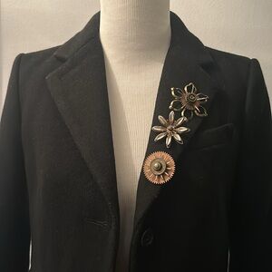 One cool metal flower brooch